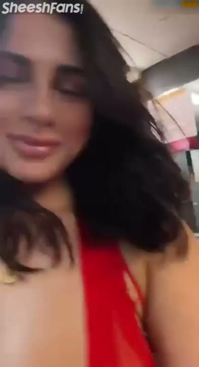 Watch Voluptuous Latina Teases In A Red Sheer Bodysuit