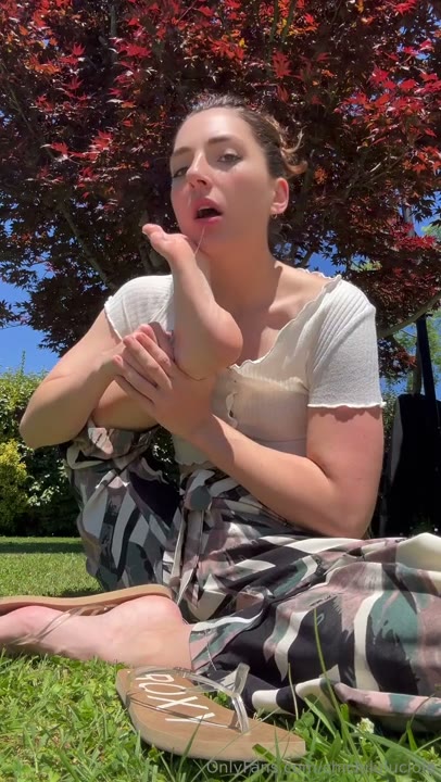 Watch ChichiLuluciole Sensually Licks Her Feet Outdoors