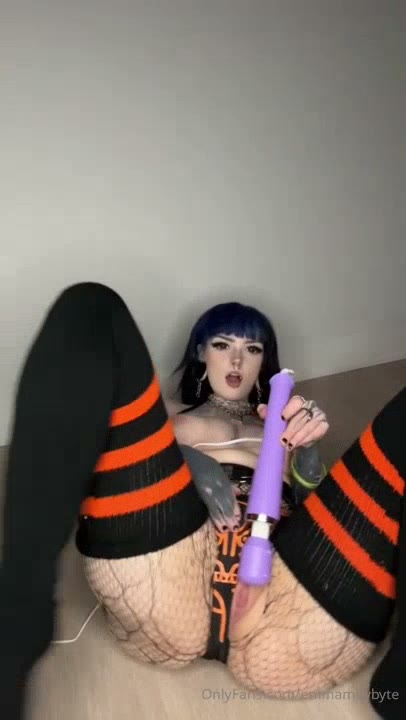 Watch Emma May’s Topless Playtime with Toys in Black Thighhighs