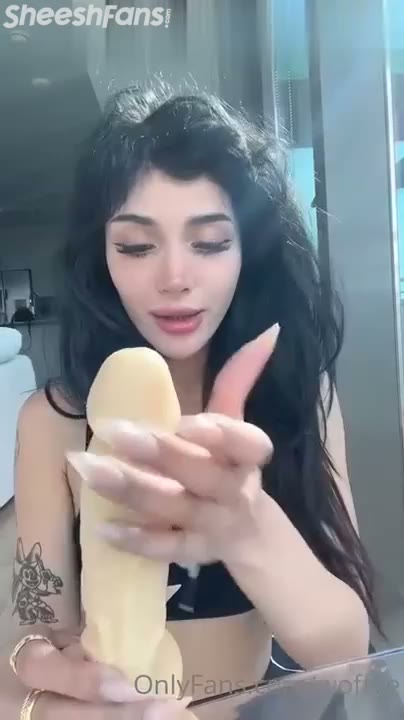 Watch Woffee Teases With Dildo Licks For The Camera